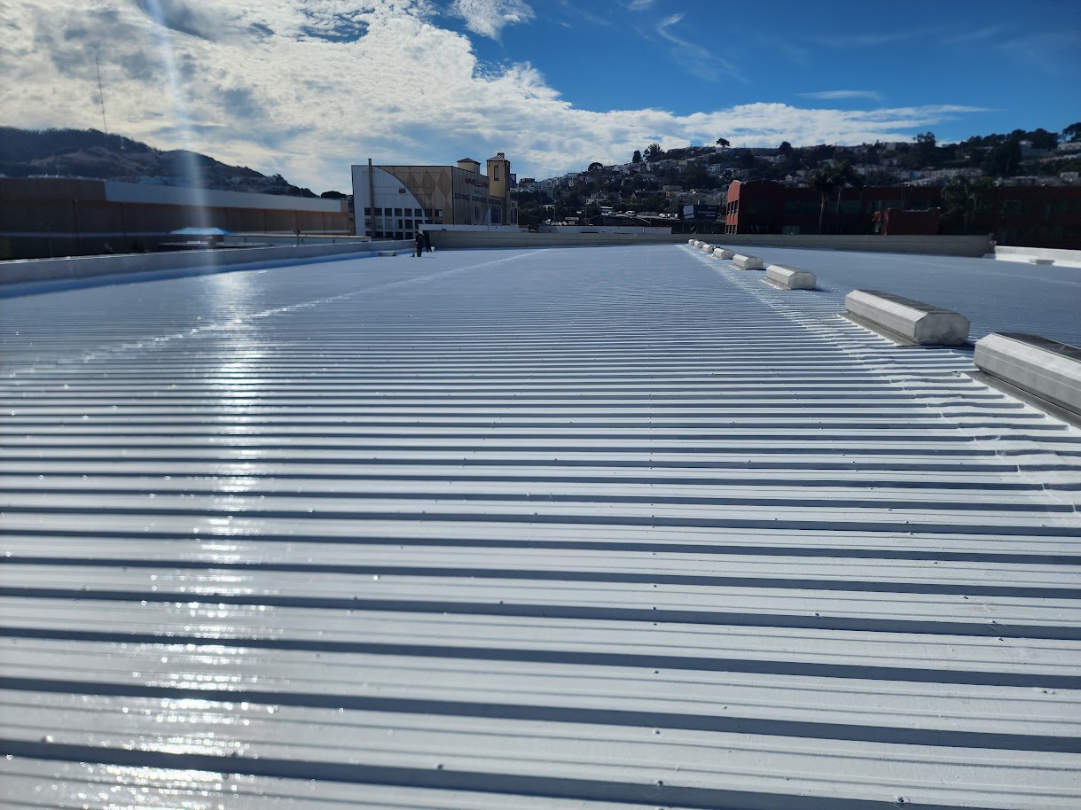 Wide view of a completed white-coated metal roof in San Francisco