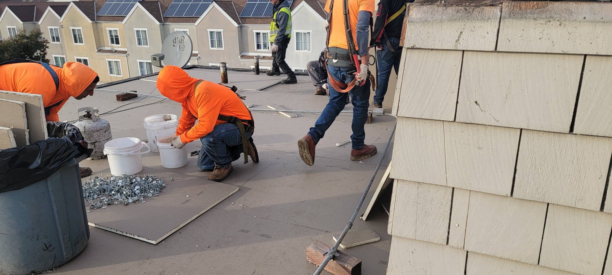Ace Roofing crew installing a new flat roof in a Sunset District neighborhood of San Francisco